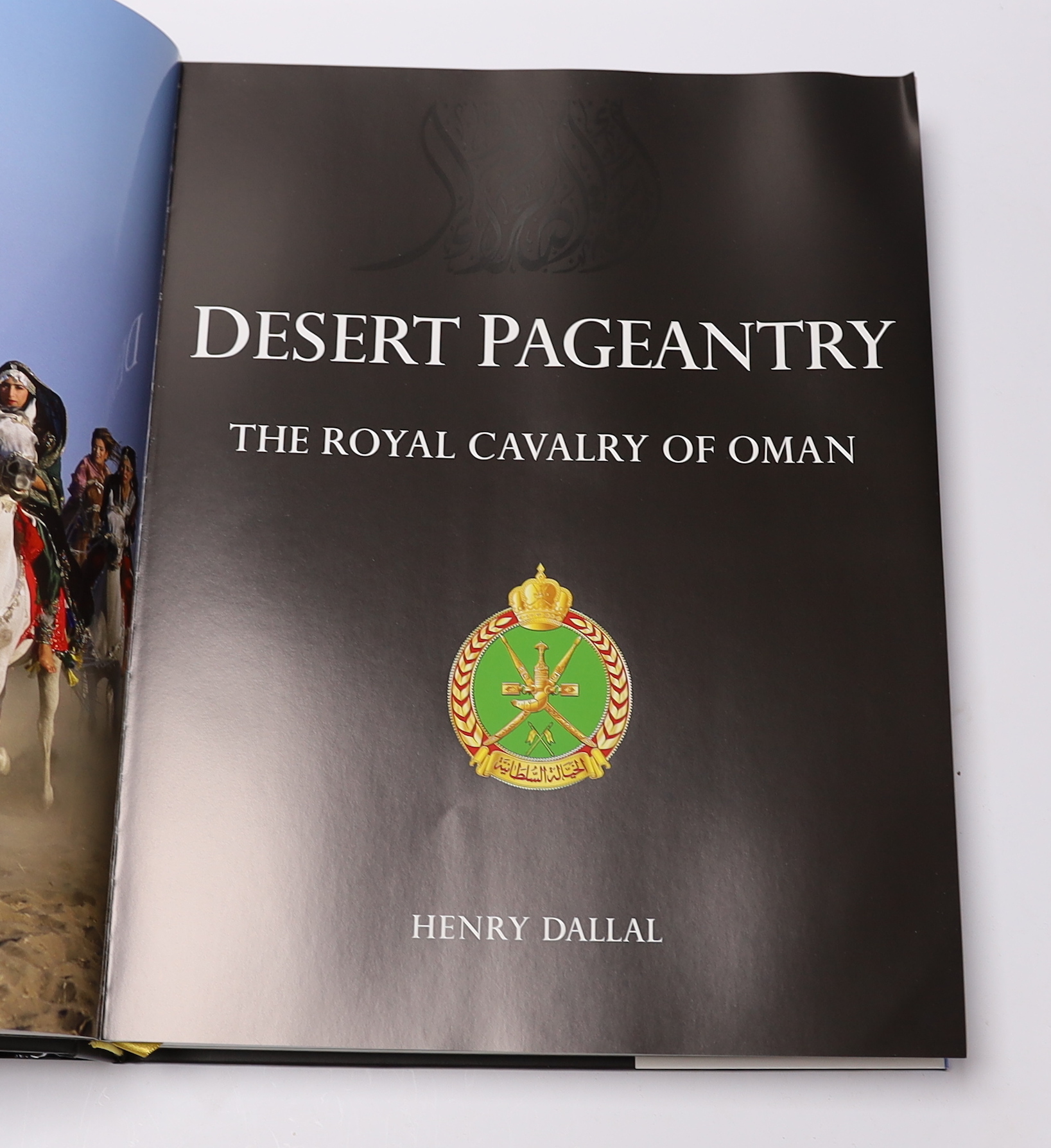 Dallal, Henry - Desert Pageantry: The Royal Cavalry of Oman, signed, folio, black pictorial boards gilt, in d/j, with original box, 2012, Note: Gold medal winner for the most outstanding design of the year, at the Indepe